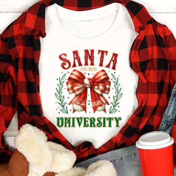 White Shirt With Santa University Design Featuring A Large Red And White Bow.