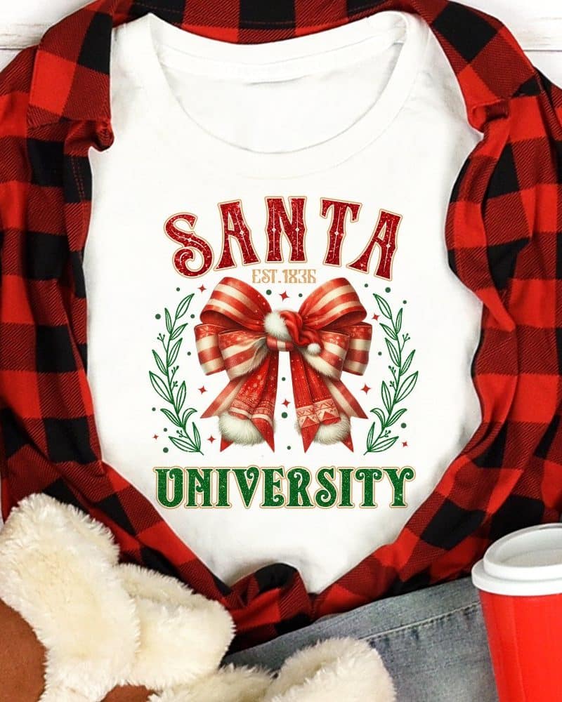 White shirt with Santa University design featuring a large red and white bow.
