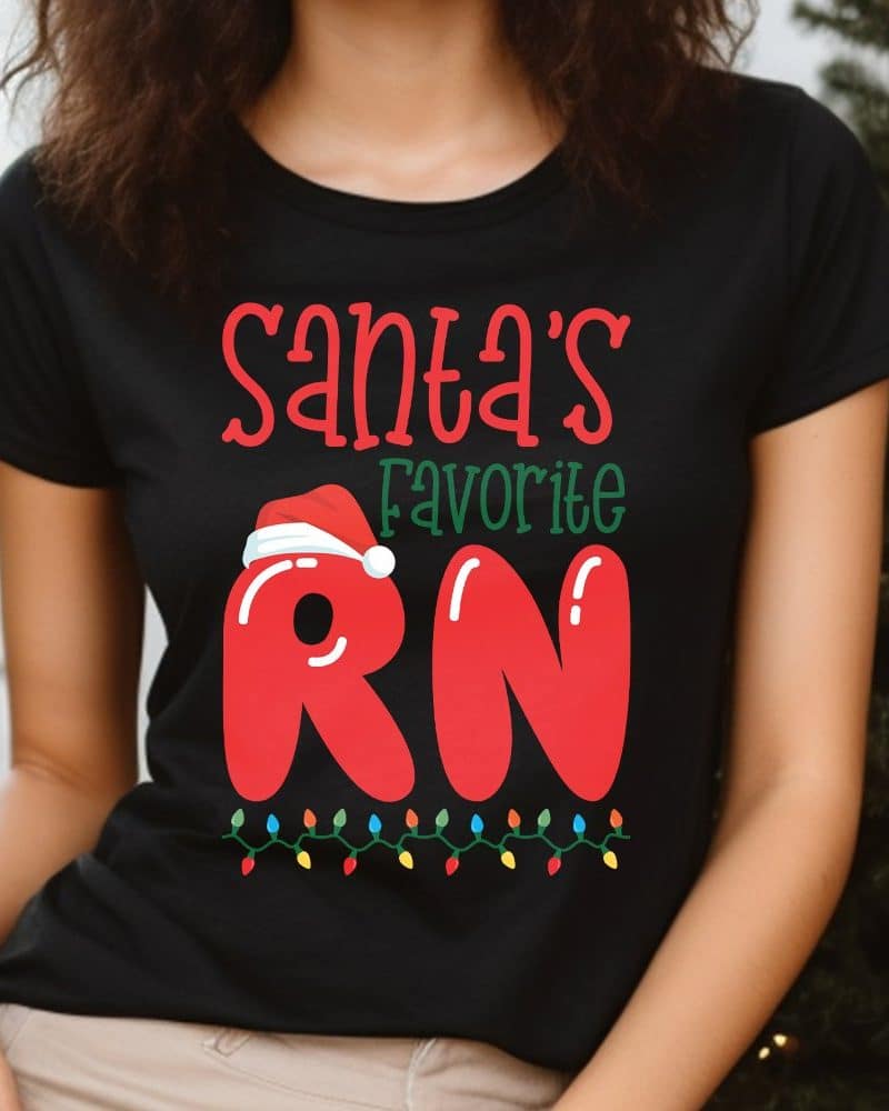 Black t-shirt with a Christmas design: Santa's favorite RN in red letters with a Santa hat on the R.