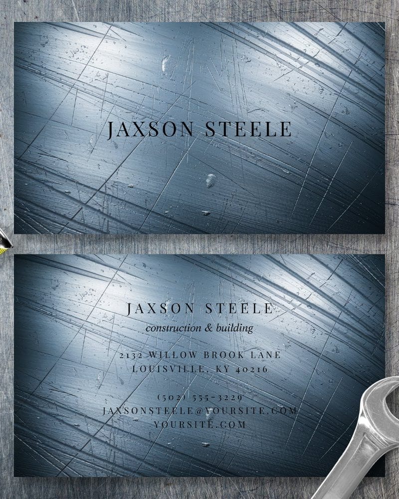 Two business cards for Jaxson Steele, construction and building, featuring a metallic blue background with scratch marks.