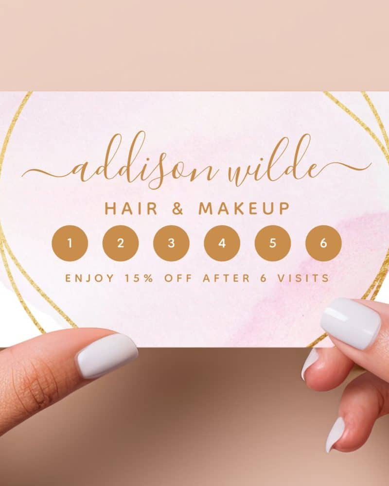 Pink and gold loyalty card for Addison Wilde Hair & Makeup; six visit punch card offering 15% off after completion.