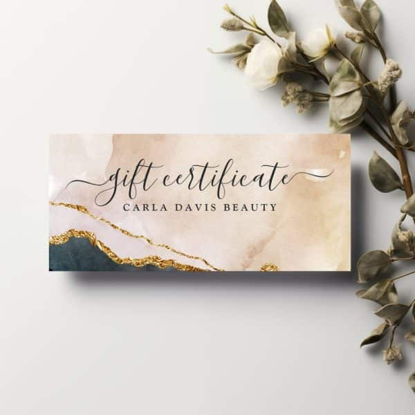 Gift Certificate For Carla Davis Beauty. The Design Features An Abstract Watercolor Background With Gold Accents.