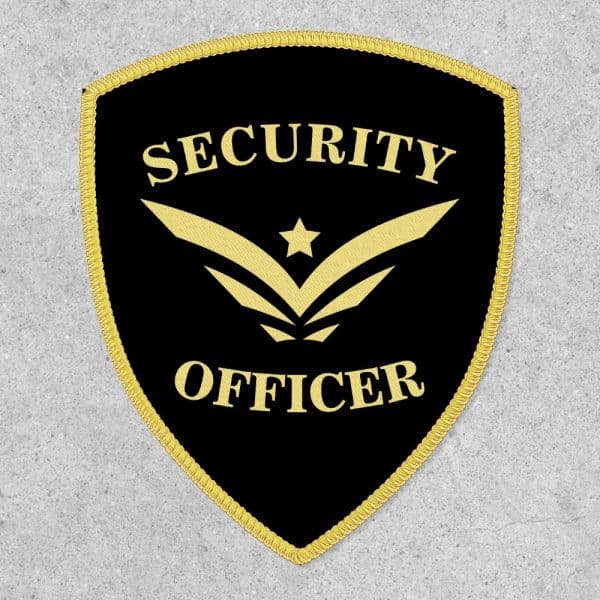 Black Shield-Shaped Security Officer Patch With Gold Trim And Lettering.