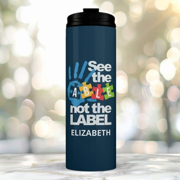 Dark Blue Travel Mug With A Handprint Graphic Incorporating The Word Able And The Text See The Able Not The Label, Personalized With The Name Elizabeth.