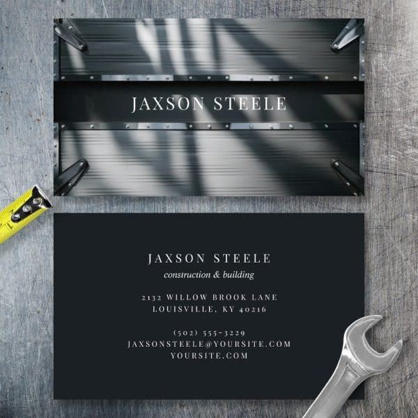 Jaxson Steele Construction And Building Business Card With A Metallic Gray Background.