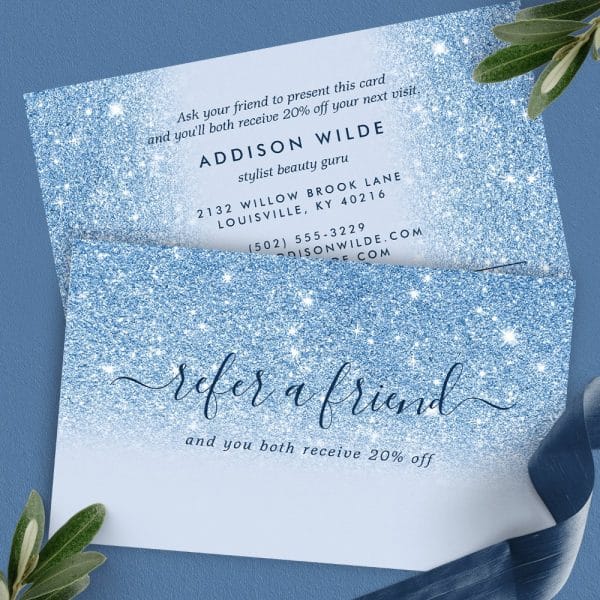 Blue Glitter Referral Card Offering 20% Off For Both Referrer And Friend. Contact Information For Addison Wilde, Stylist, Is Included.