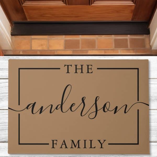 Tan Doormat With The Anderson Family In A Black Sans Serif And Script Font.