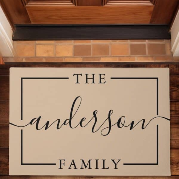 Beige Doormat With The Text The Anderson Family In A Simple, Elegant Font.