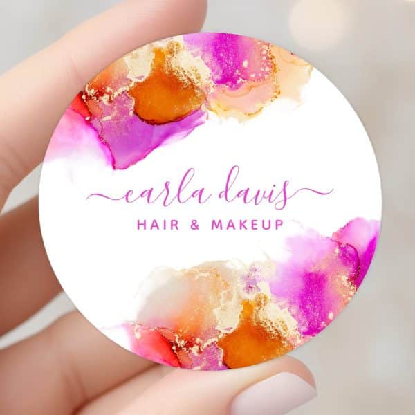 Round Business Card Featuring Abstract Pink, Orange, And Gold Watercolor Design; Carla Davis Hair &Amp; Makeup.