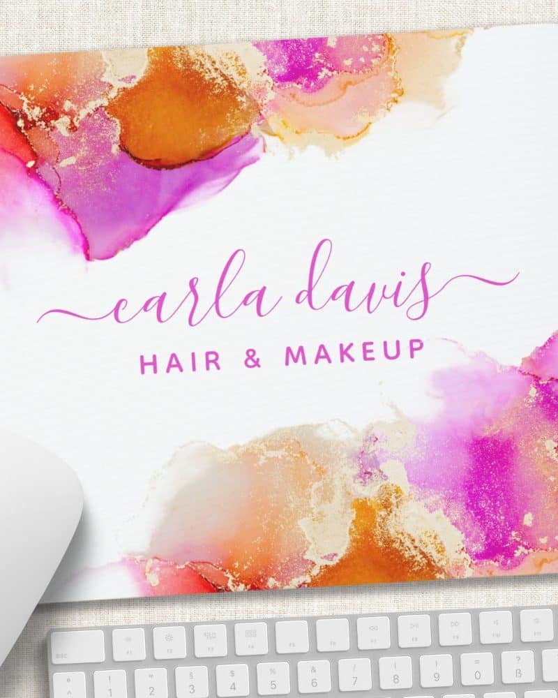 Mousepad with pink and gold abstract design and Carla Davis Hair & Makeup.