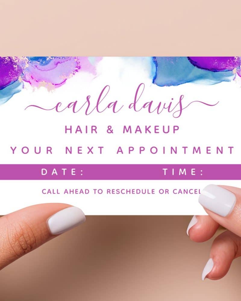 Appointment card for Carla Davis Hair & Makeup, featuring an abstract purple and blue watercolor design.