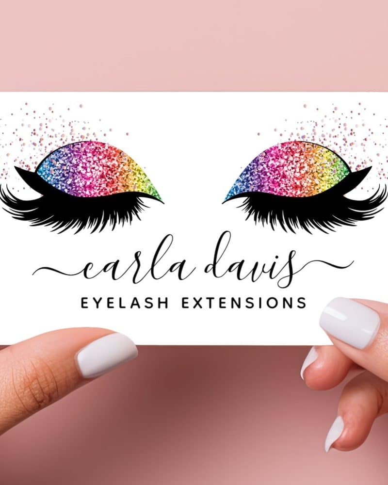 A business card featuring rainbow glitter eyelashes and the text Carla Davis Eyelash Extensions.