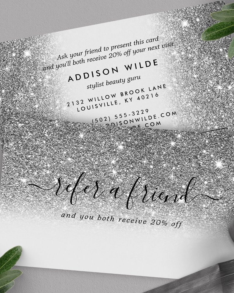 Silver glitter referral card for Addison Wilde, stylist. Includes contact information and offer details.