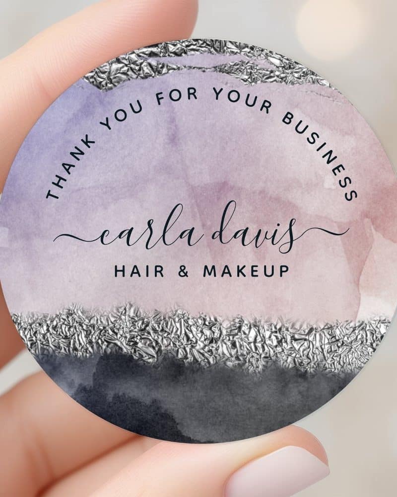 Round thank you sticker for Carla Davis Hair & Makeup. The design features a watercolor wash of purple and gray with a silver foil accent.
