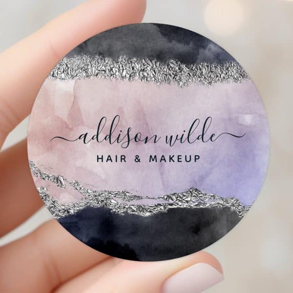 Round Business Card Featuring Watercolor Washes Of Purple, Pink, And Gray, Accented With Silver Foil, Displaying The Name Addison Wilde, Hair &Amp; Makeup.