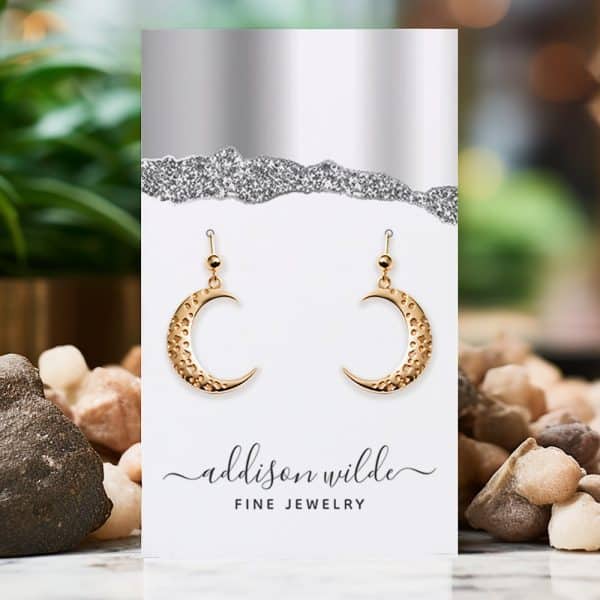 Gold Crescent Moon Earrings Displayed On A Jewelry Card.