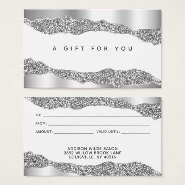Silver Glitter Gift Certificate With Space To Fill In Recipient, Sender, Amount, And Expiration Date. The Salon'S Name And Address Are Included At The Bottom.