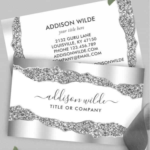 Silver Glitter Business Card With Addison Wilde'S Name And Contact Information.