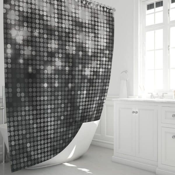 Black And White Dotted Shower Curtain Partially Draped Over A White Bathtub.