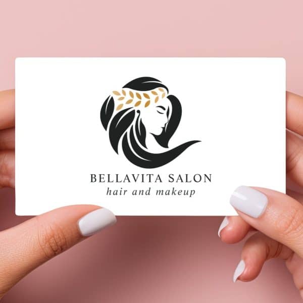 Bellavita Salon Business Card Featuring A Logo Of A Woman'S Profile With Flowing Hair And A Gold Leaf Crown.