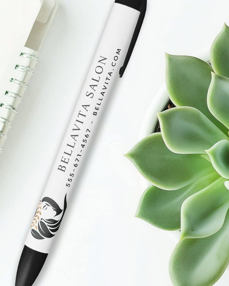 White pen with Bella Vita Salon logo and contact information.