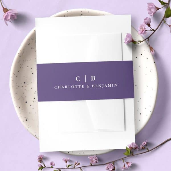 Wedding Invitation With A Purple Band Featuring The Initials Cb And The Names Charlotte &Amp; Benjamin.