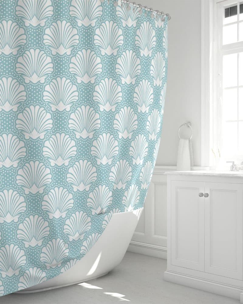 Light blue shower curtain with a white seashell pattern.