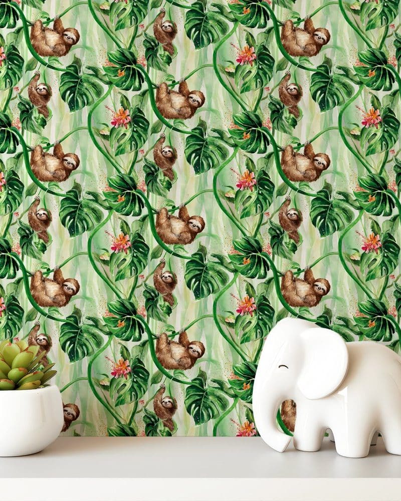 Watercolor sloth pattern wallpaper with a white elephant figurine in the foreground.