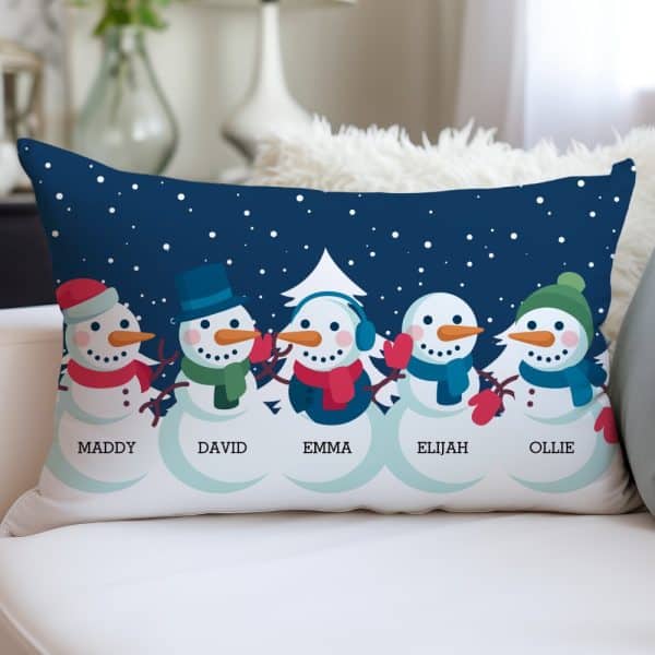 Rectangular Pillow Featuring Five Snowmen In A Row Against A Dark Blue Snowy Night Background, Each Snowman Labeled With A Name.