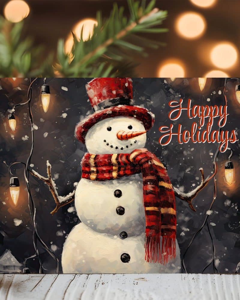 A painted snowman wearing a red hat and scarf stands in a snowy scene with string lights. Happy Holidays is written above the snowman.