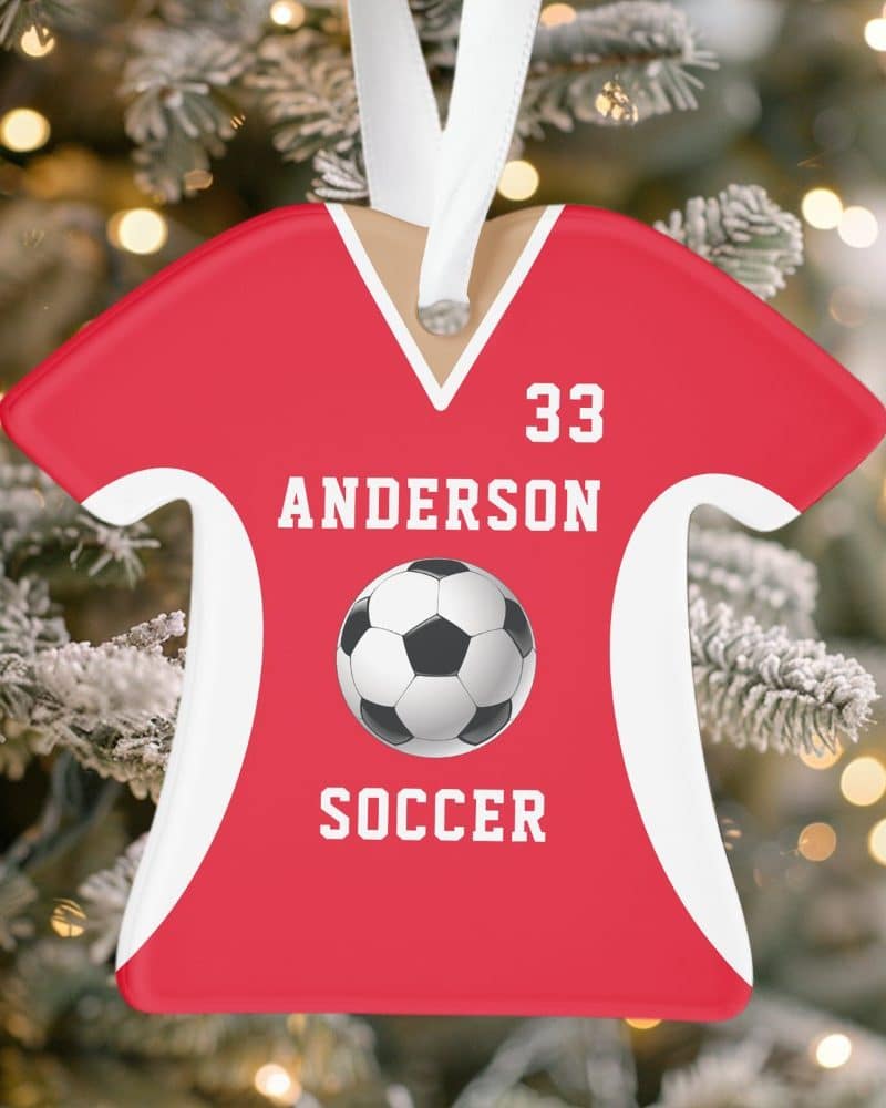 Red soccer jersey-shaped Christmas ornament with the name Anderson, number 33, and a soccer ball.