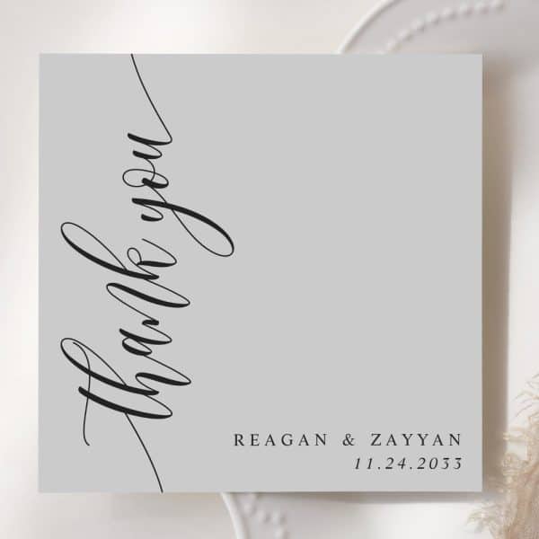 Gray Thank You Card With Elegant Script Lettering. The Names Reagan &Amp; Zayyan And The Date 11.24.2033 Are Printed Below.