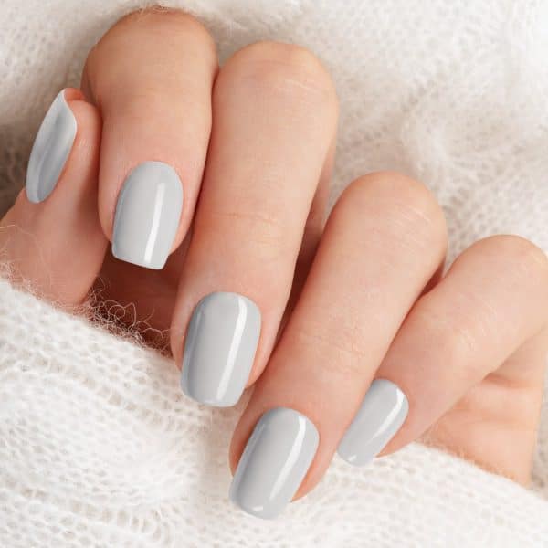 Hand With Light Gray Nail Polish.