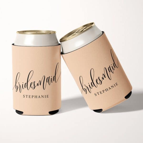 Two Beige Can Coolers, Personalized With The Word Bridesmaid And The Name Stephanie In Elegant Script.