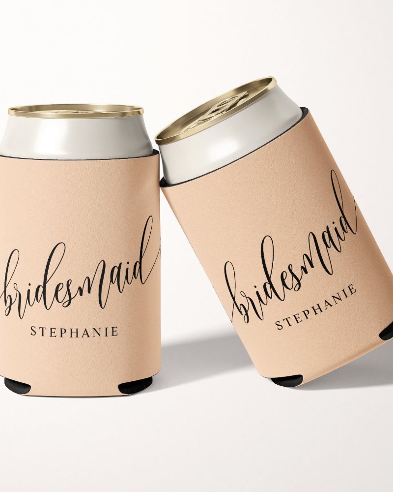 Two beige can coolers, personalized with the word Bridesmaid and the name Stephanie in elegant script.