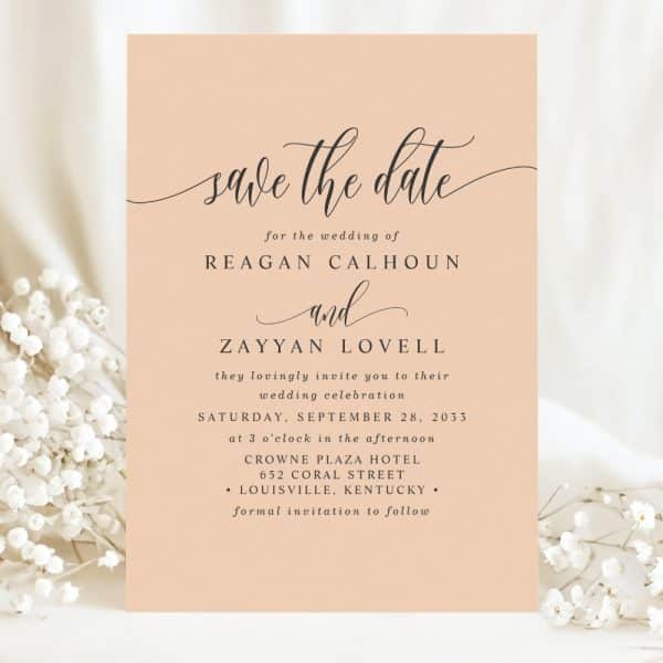 Peach-Colored Save-The-Date Card For Reagan Calhoun And Zayyan Lovell'S Wedding On September 28, 2033, At The Crowne Plaza Hotel In Louisville, Kentucky.