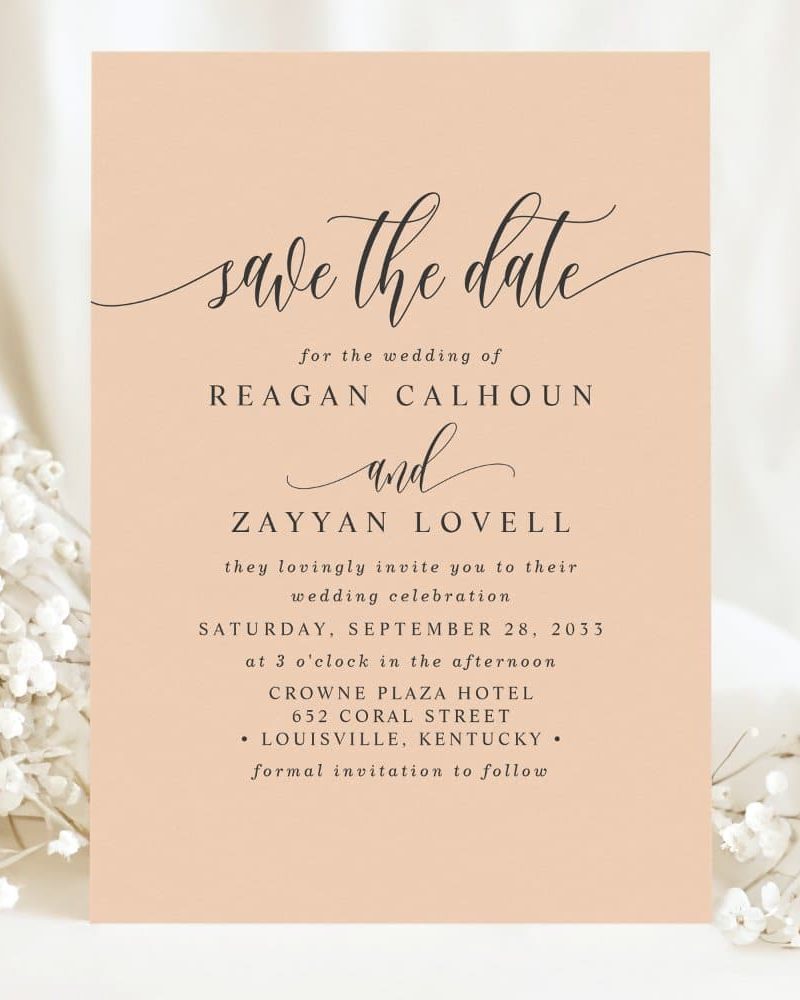 Peach-colored save-the-date card for Reagan Calhoun and Zayyan Lovell's wedding on September 28, 2033, at the Crowne Plaza Hotel in Louisville, Kentucky.