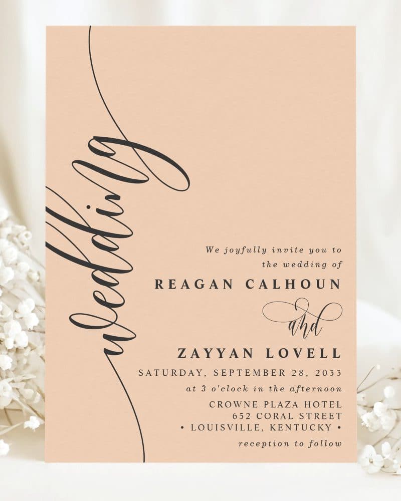 Peach-colored wedding invitation for Reagan Calhoun and Zayyan Lovell, September 28, 2033, at the Crowne Plaza Hotel in Louisville, Kentucky.