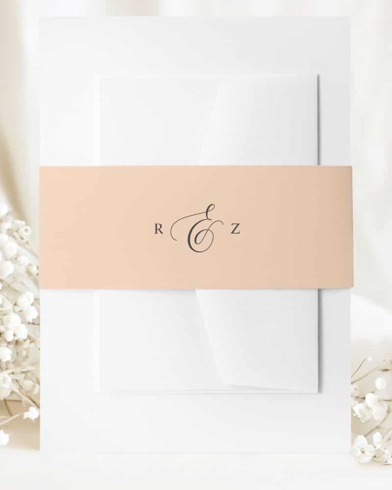 Wedding invitation with a peach-colored band and the initials R & Z.
