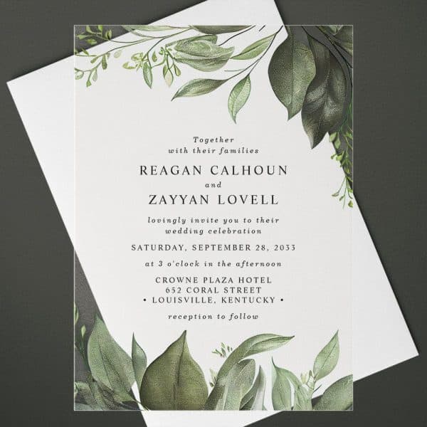 Wedding Invitation With Greenery Border, Announcing The Marriage Of Reagan Calhoun And Zayyan Lovell.