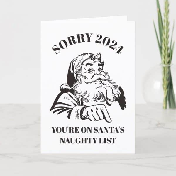 A Christmas Card Featuring A Black And White Illustration Of Santa Claus Pointing, With The Text Sorry 2024, You'Re On Santa'S Naughty List.