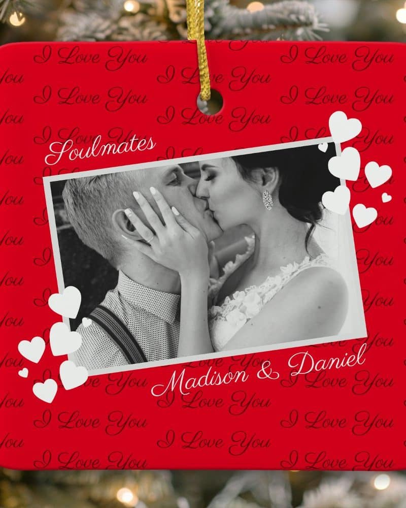 Red Christmas ornament featuring a black and white photo of a kissing couple, names Madison & Daniel, and the word Soulmates. White hearts decorate the ornament.