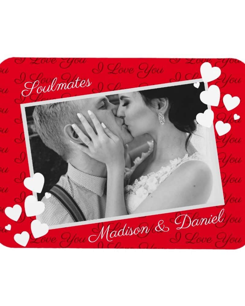 A black and white photo of a couple kissing, surrounded by white hearts and a red background with the words I Love You and Soulmates. The names Madison & Daniel are also visible.
