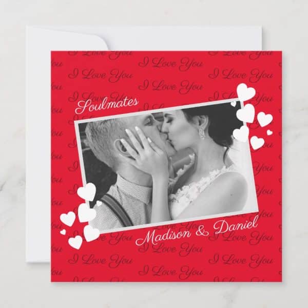 A Red Card With A Black And White Photo Of A Couple Kissing. The Card Features The Words &Quot;Soulmates&Quot; And &Quot;Madison &Amp; Daniel&Quot; Along With A Repeating &Quot;I Love You&Quot; Pattern. White Hearts Surround The Photo.