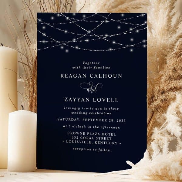 Wedding Invitation For Reagan Calhoun And Zayyan Lovell, Featuring A Dark Blue Background With String Lights.