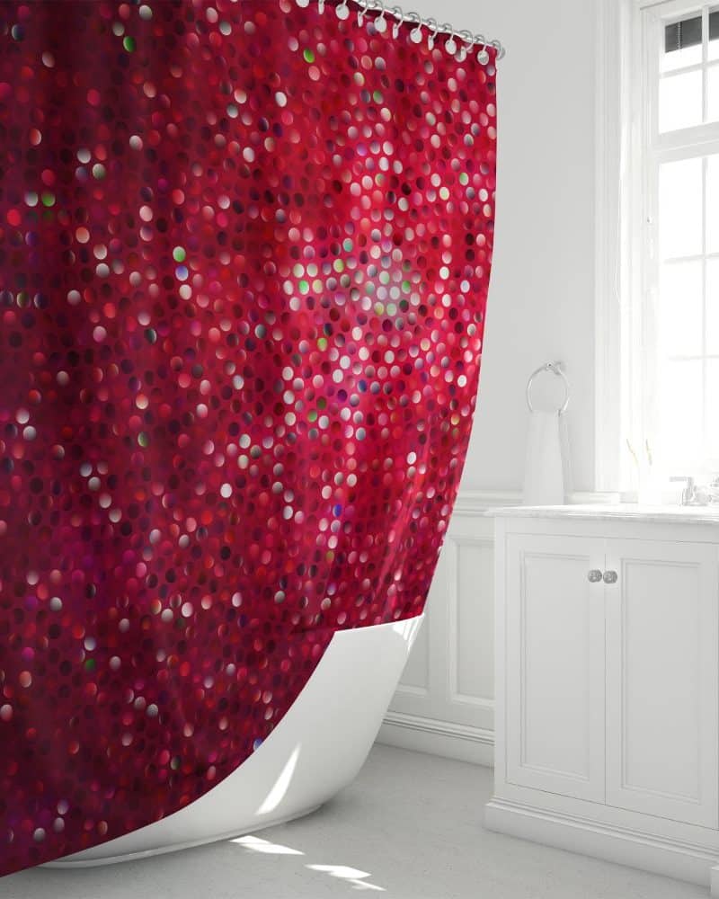 Red shower curtain with a sparkly dotted pattern.