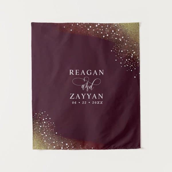 Burgundy Wedding Banner With Gold Confetti And The Names Reagan And Zayyan And Wedding Date.