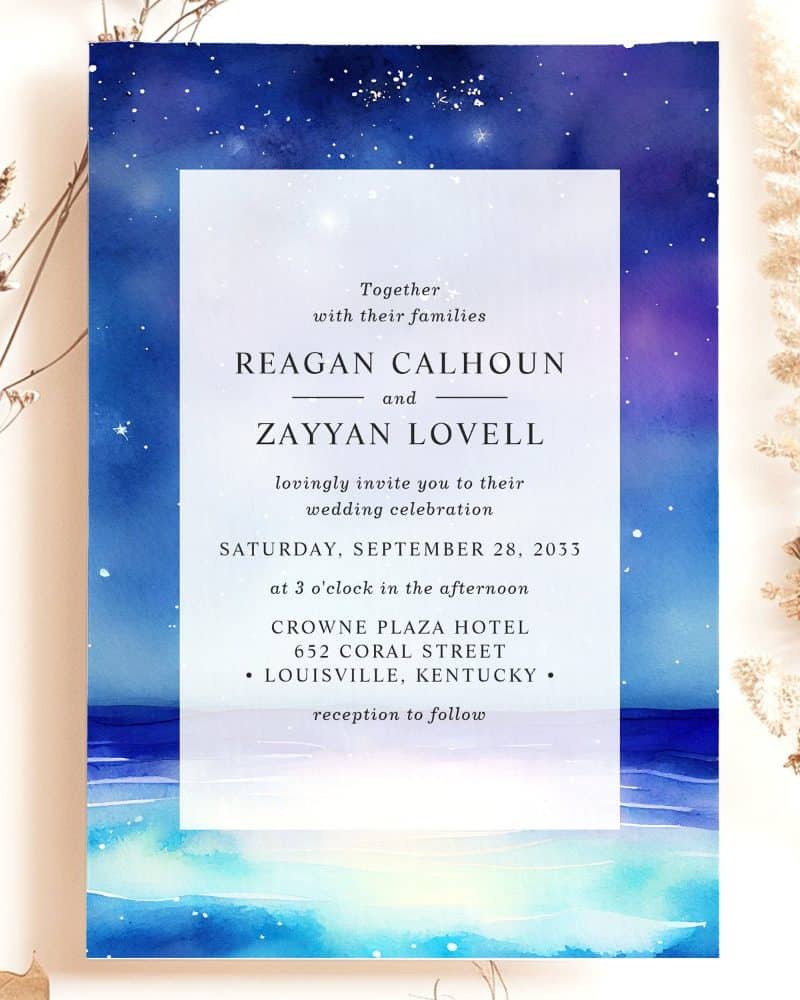 Wedding invitation with watercolor night sky and ocean scene.