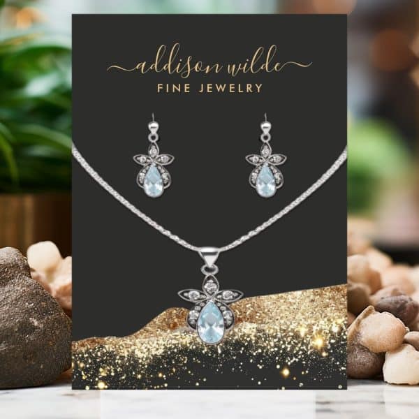Aquamarine Pendant Necklace And Earring Set With Silver Floral Accents.