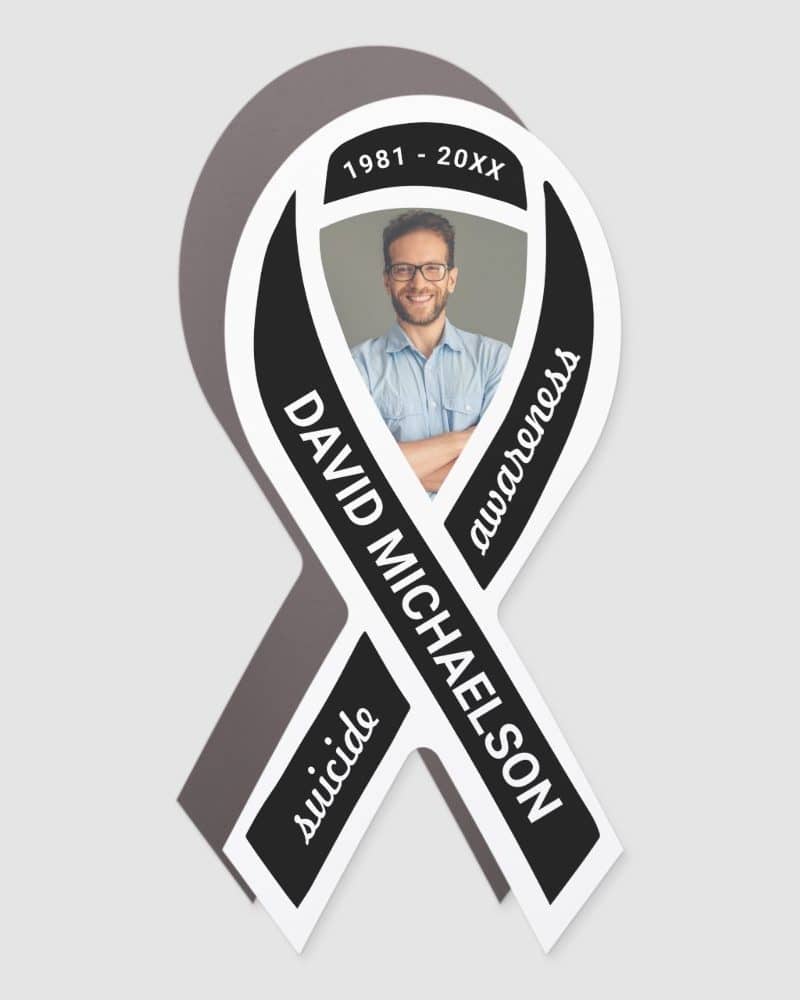 Black awareness ribbon with a photo of David Michaelson, 1981-20XX, and the word suicide.
